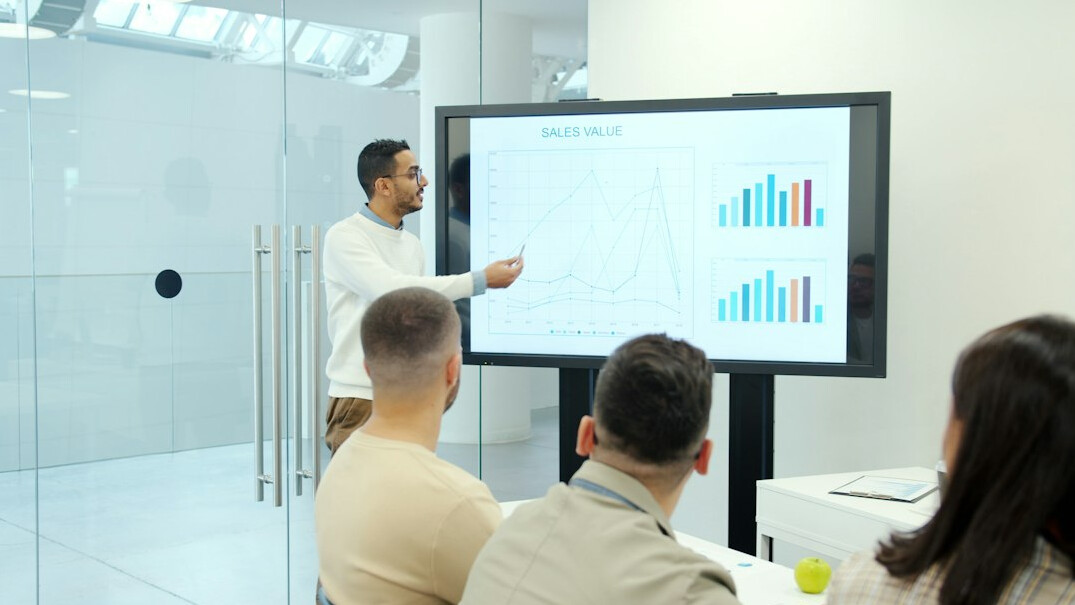 business leader presenting to team