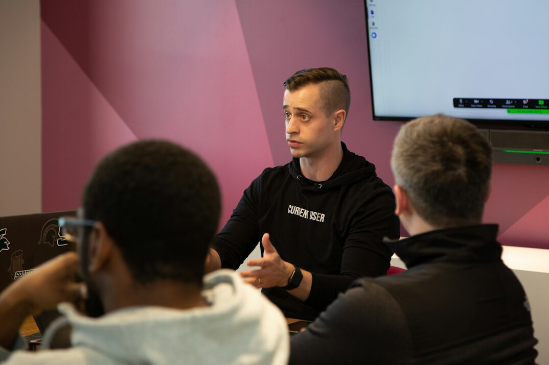 Team leader leading a meeting in a conference room