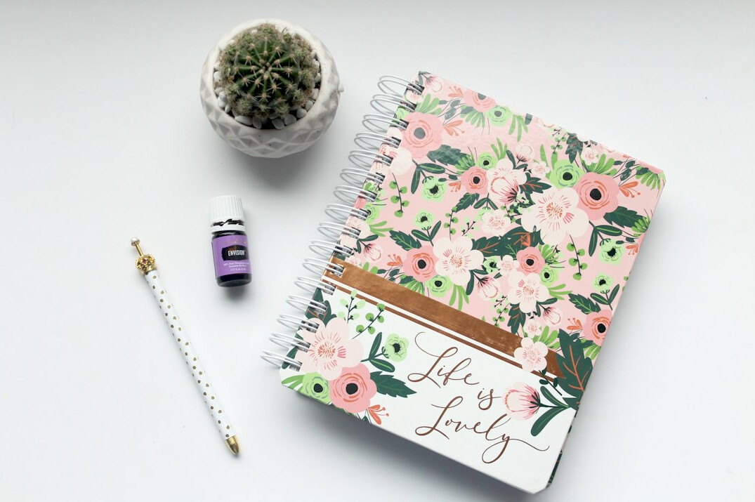Notebook with handwritten schedule and pen on a desk